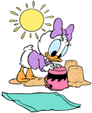Baby Daisy building a sandcastle at the beach