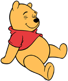 Winnie the Pooh sitting down smiling with his eyes closed